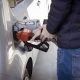 man refilling gas