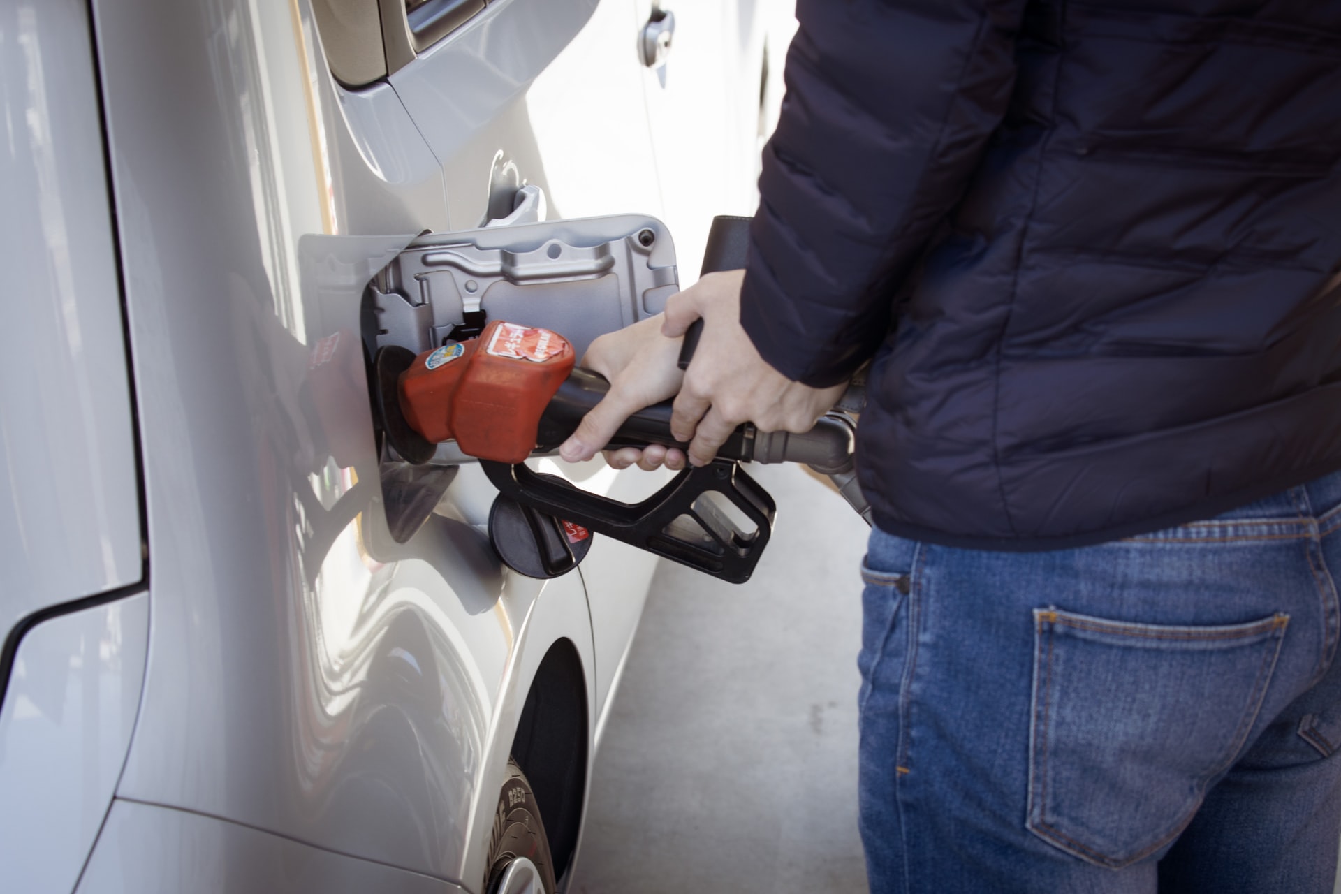 man refilling gas