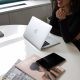 Meeting on table with laptop and magazines