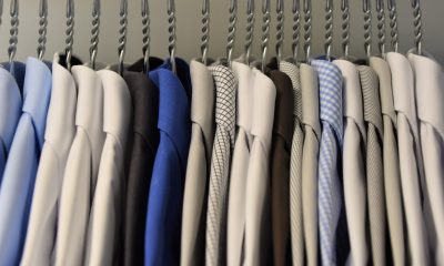Assorted colored dress shirts hung