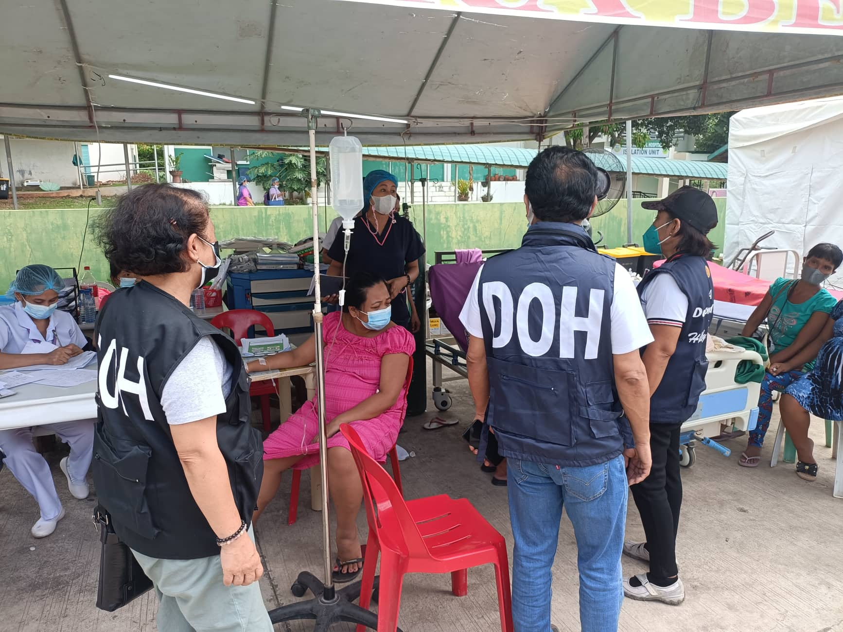 DOH personnels talking with victims