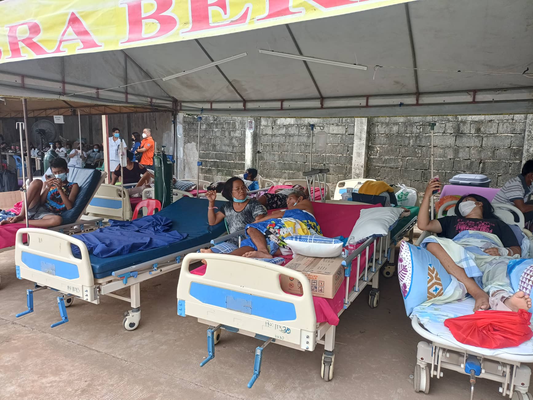 quake victims on hospital bed