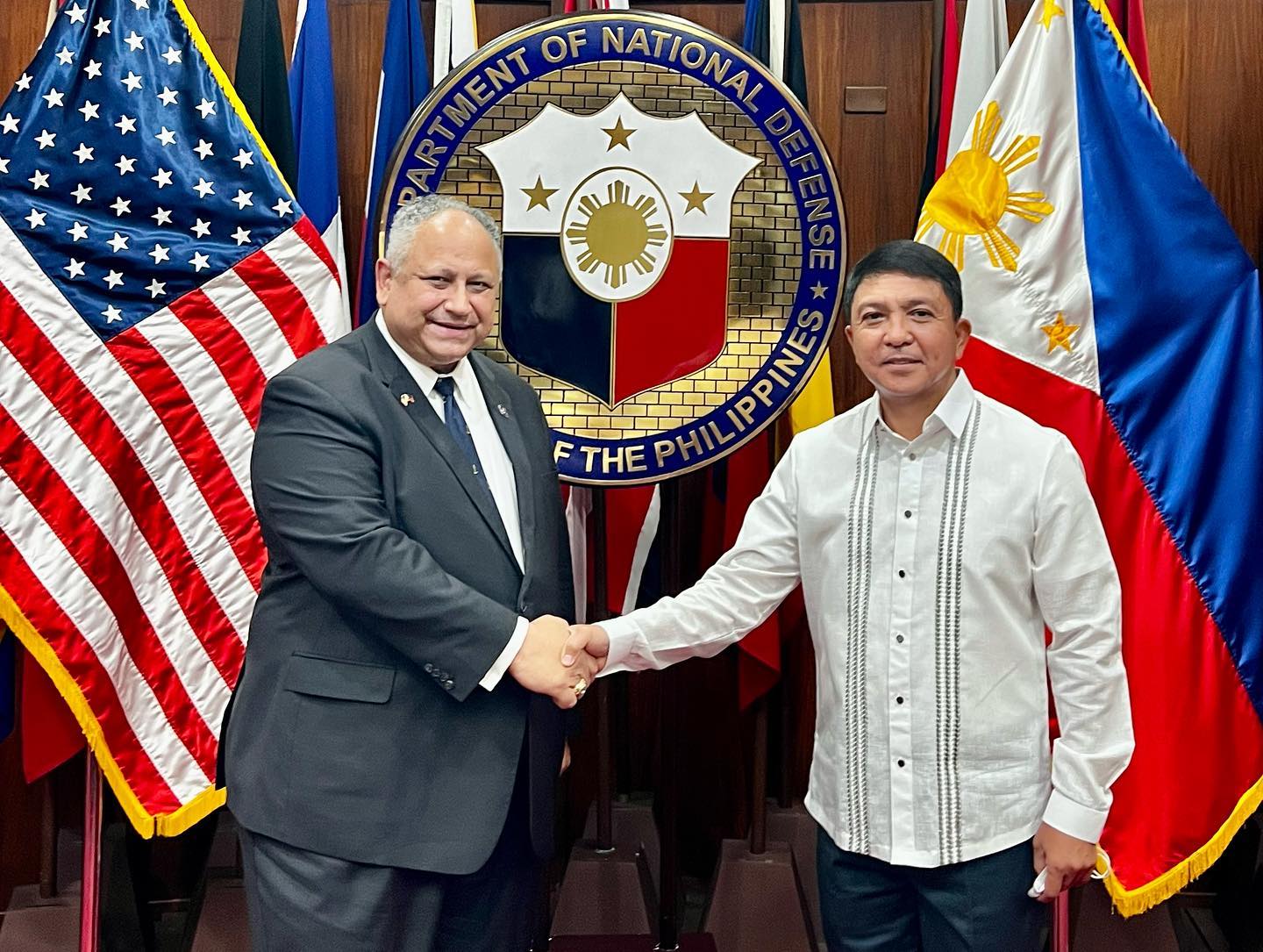 US Secretary of the Navy Carlos del Toro anf DND Undersecretary Franco Nemesio Gacal shaking hands for a picture