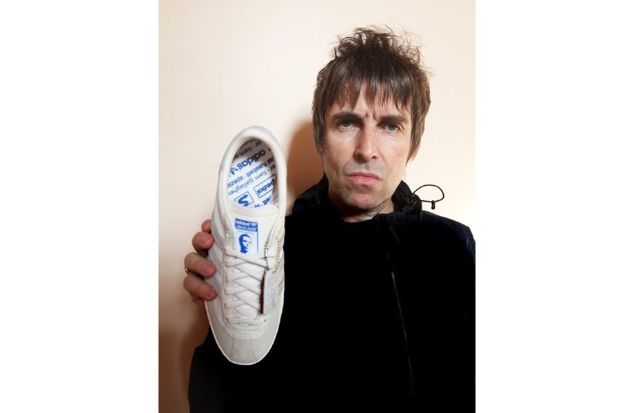Liam Gallagher holding the brand new LG2 SPZL trainer