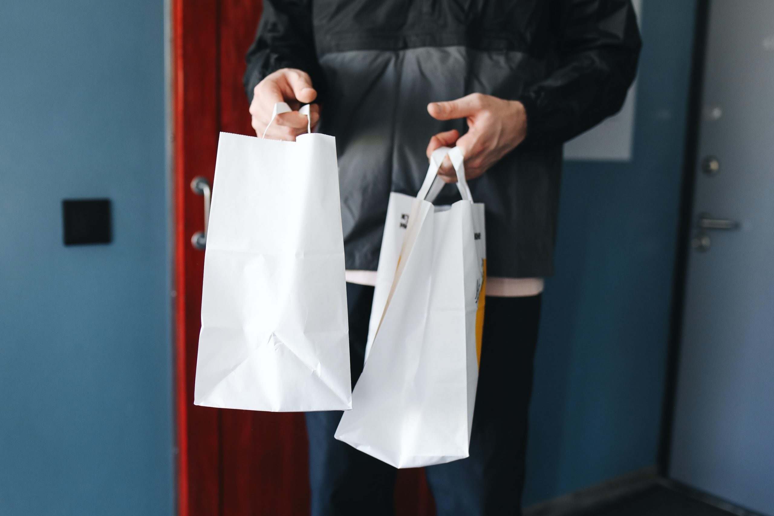 A Person Holding Paper Bags