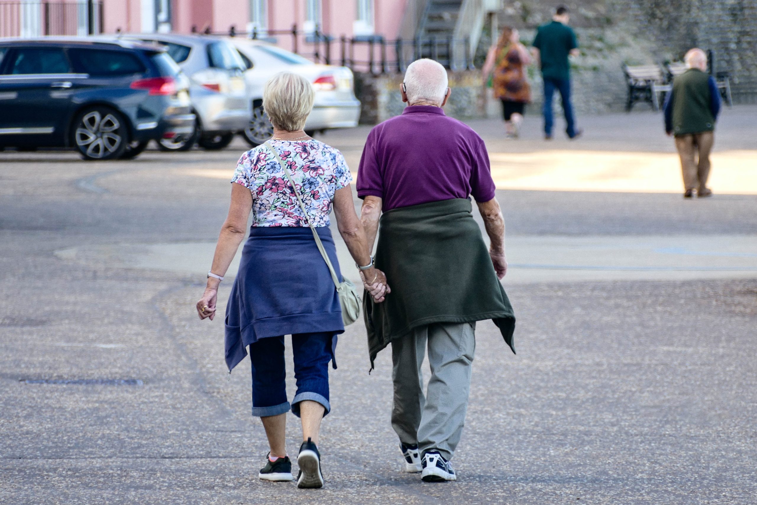 Couple holding hands while walking