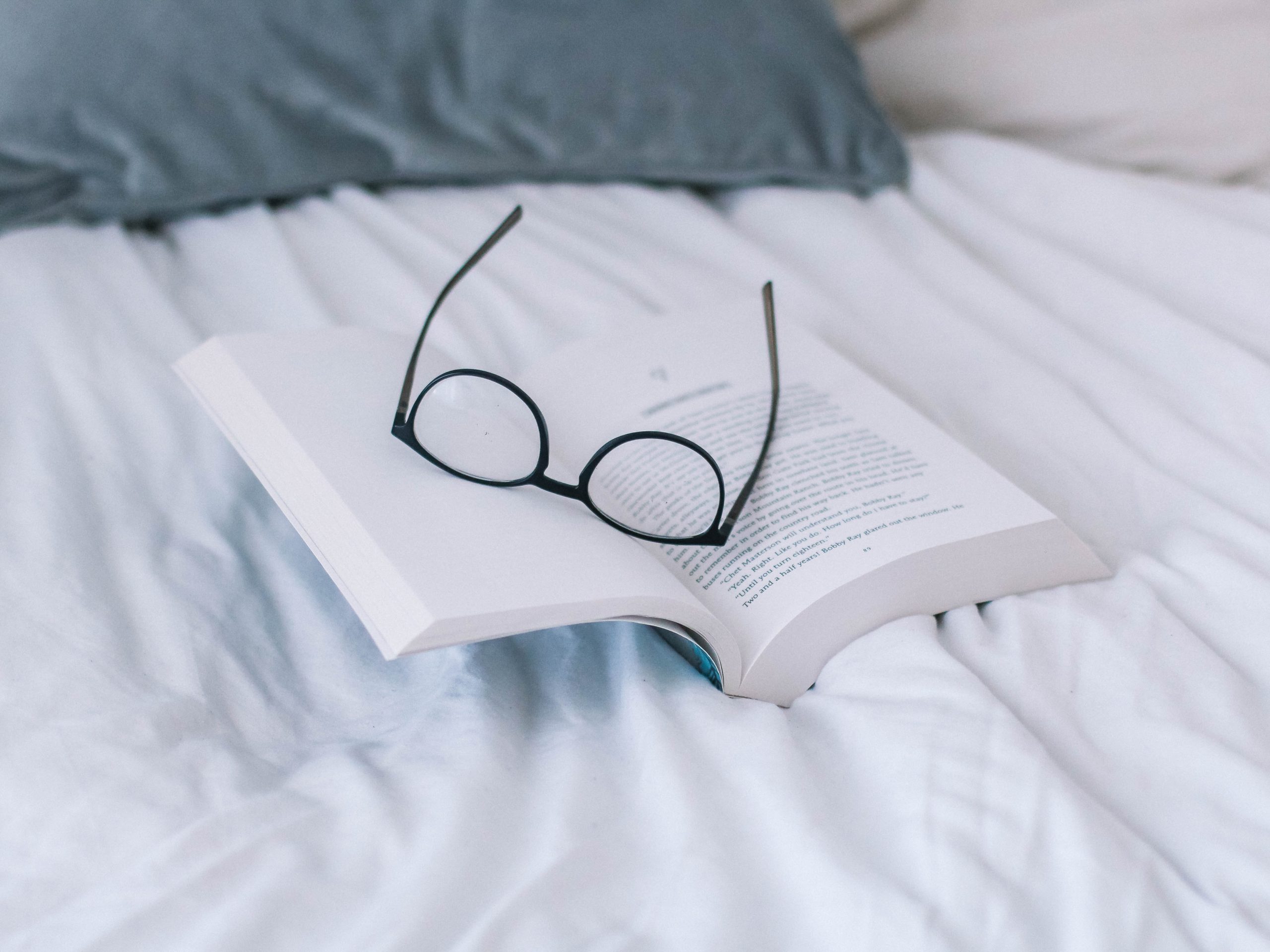 Eyeglasses on book page