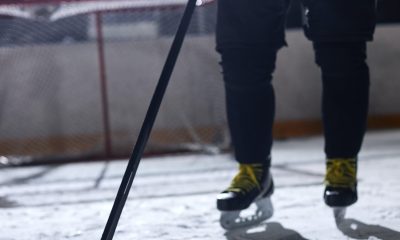 Ice Hockey Player Holding a Hockey Stick