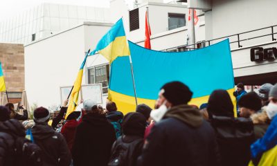 People Protesting While Holding Ukraine Flags