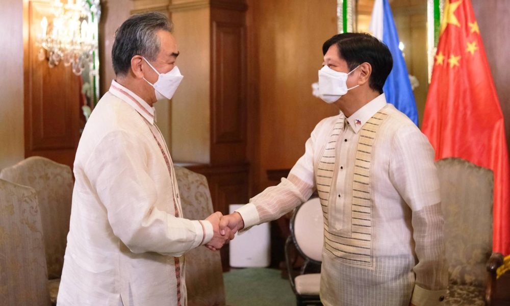 President Bongbong Marcos shakes hands with Chinese Foreign Minister Wang Yi