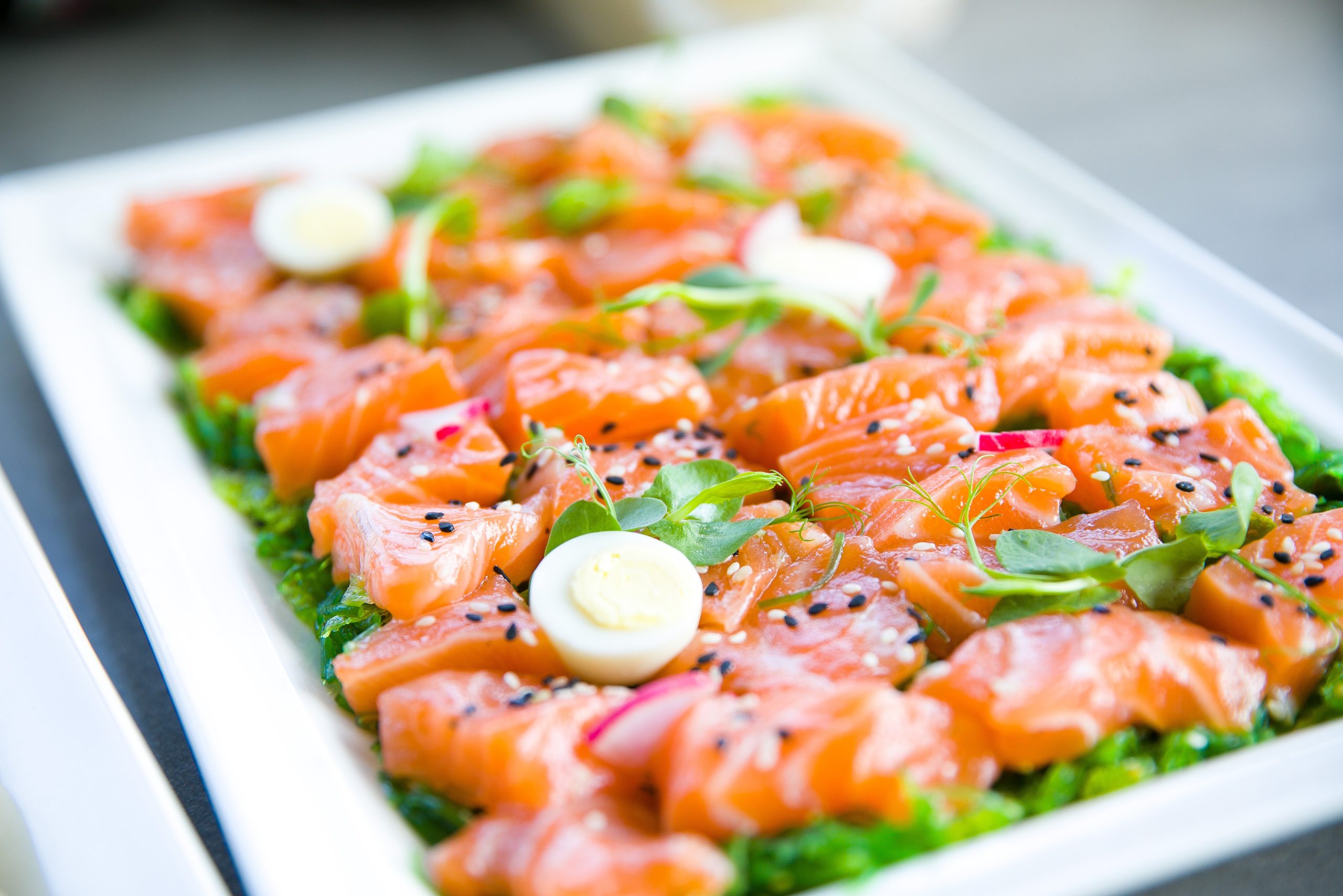 Salmon with greens and quail eggs