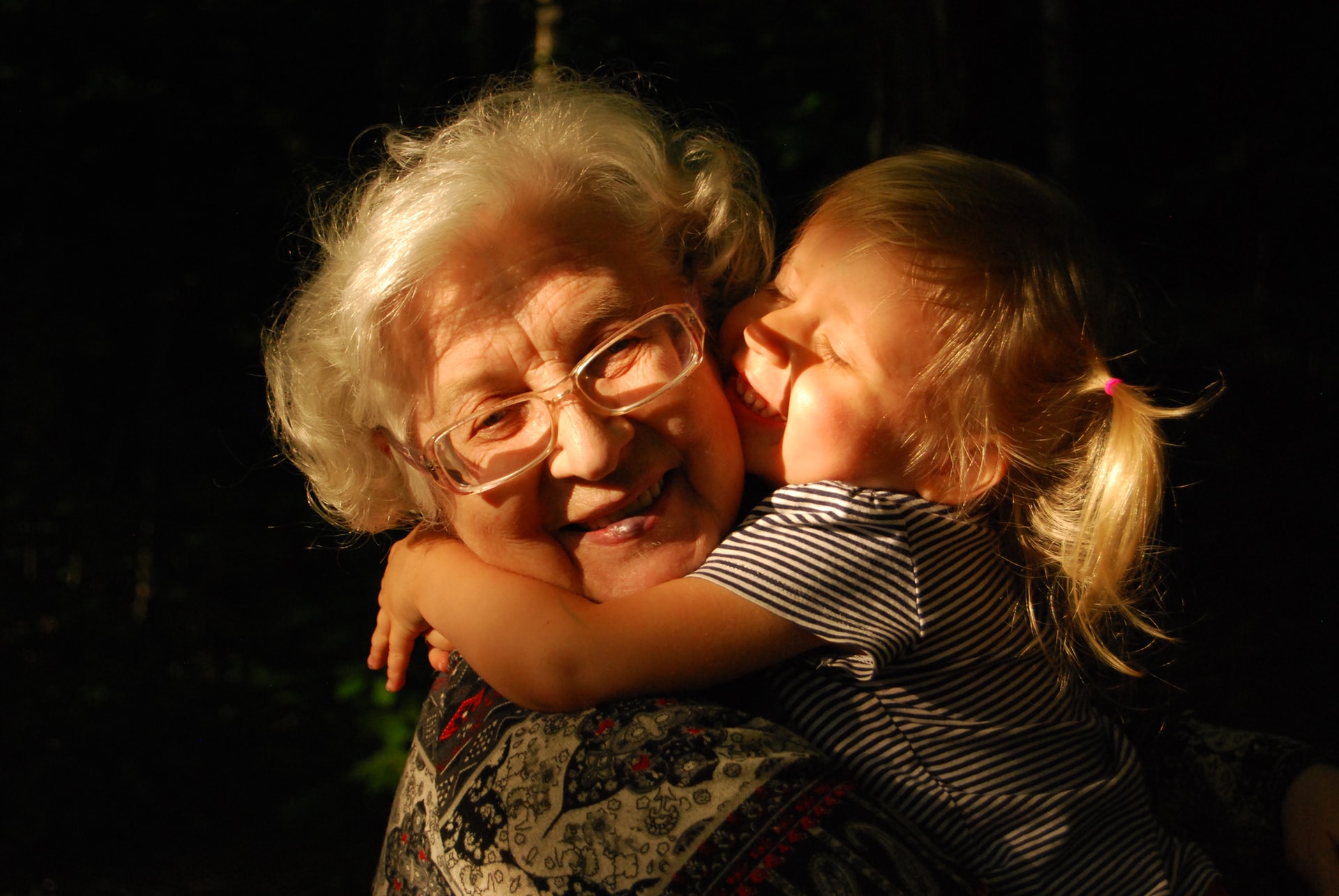girl hugging grandmother