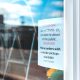 store announcement on glass wall