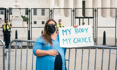 woman with "my body, my choice" sign
