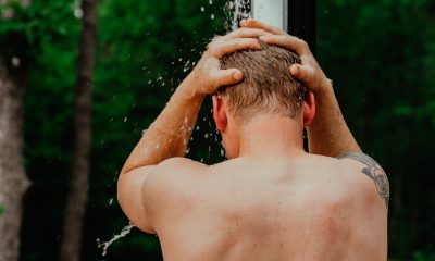 man taking shower outside