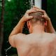 man taking shower outside