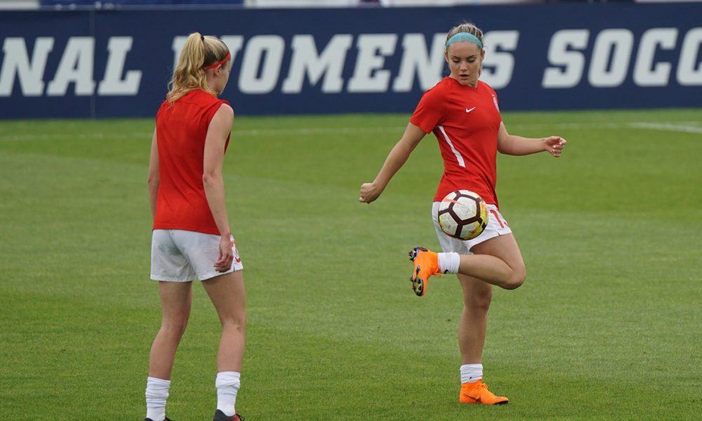 women playing football