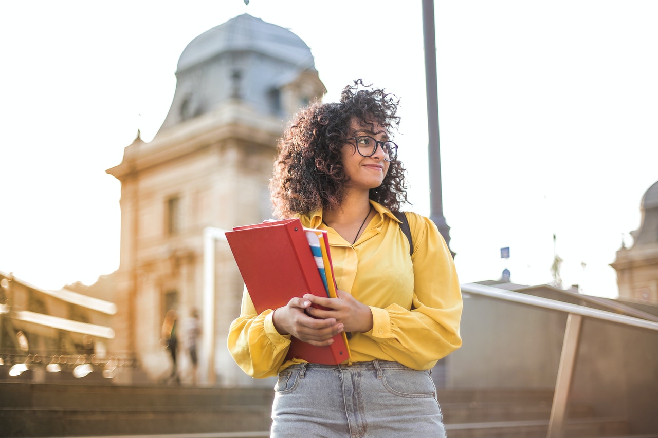 woman holding books