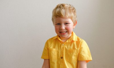 boy wearing yellow polo