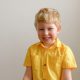 boy wearing yellow polo