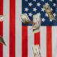 flying dollars and usa flag background