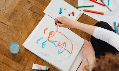 Person Painting while Sitting on the Floor