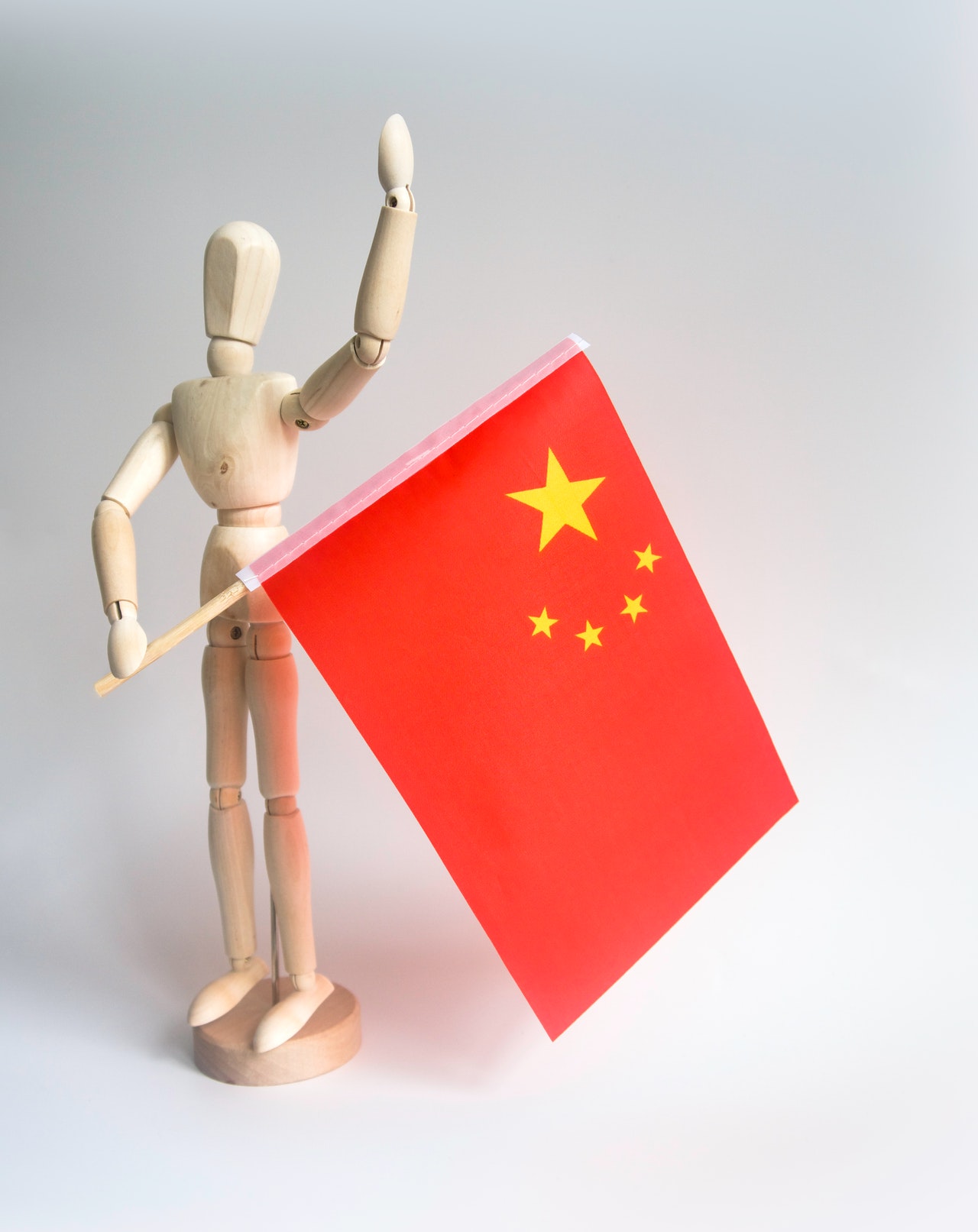 figure holding China flag
