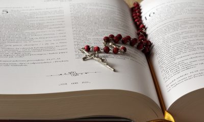 rosary over a bible