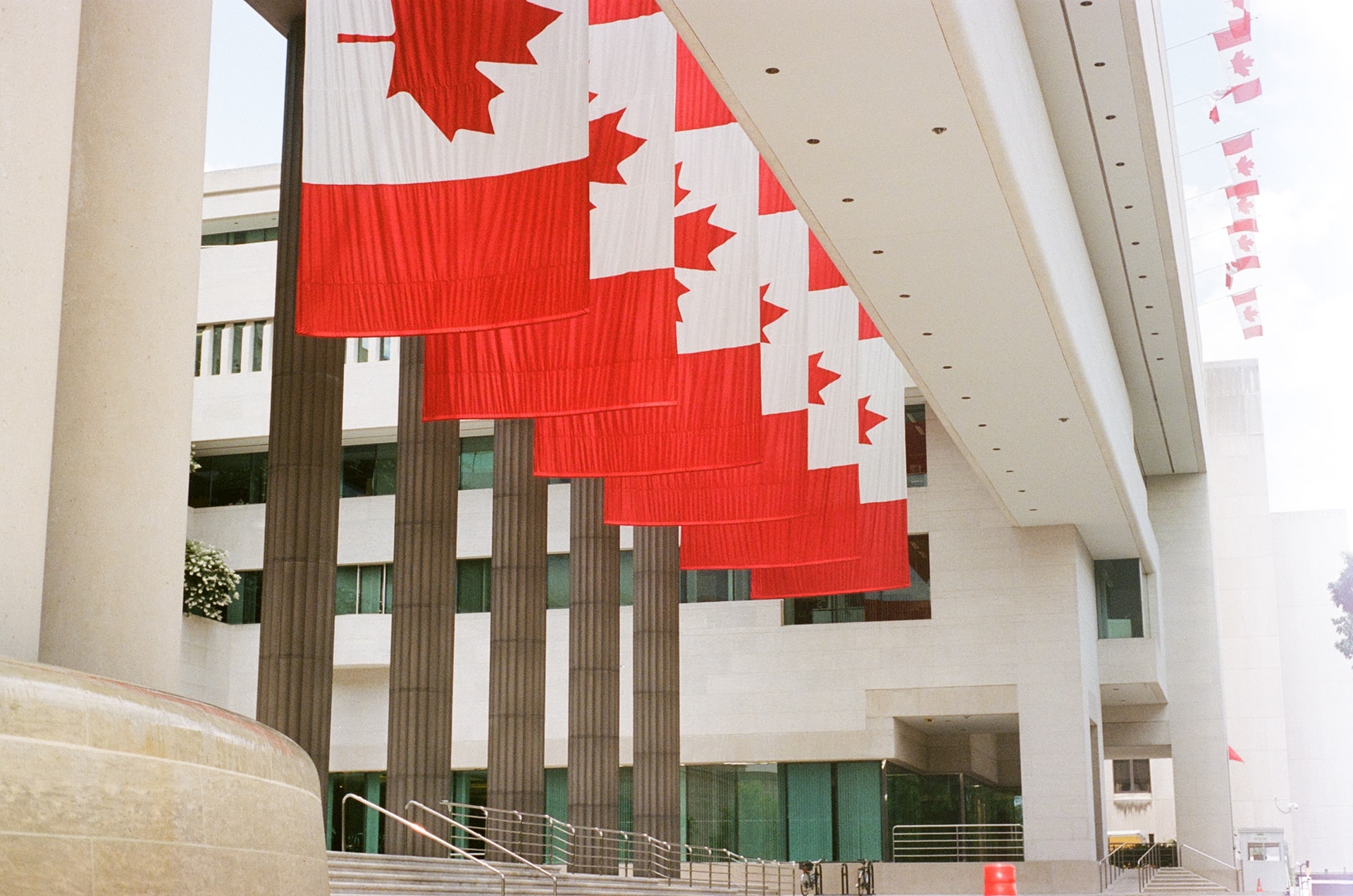 building with Canadian flags