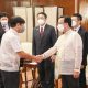 PBBM and Huang Xilian shake hands