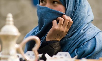 Afghan woman covering her face