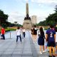 Filipinos visiting the monument of Dr. Jose Rizal in Manila