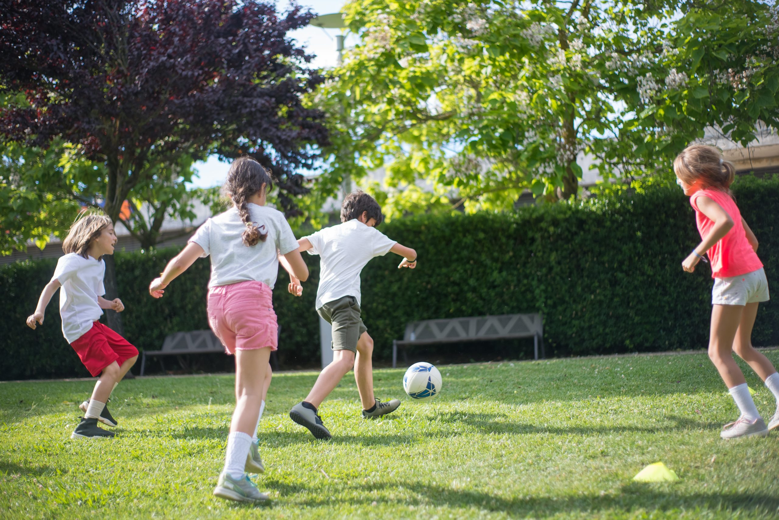 Kids Playing Football on the Field