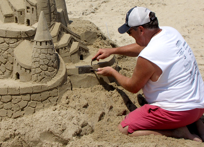 Man building sandcastle