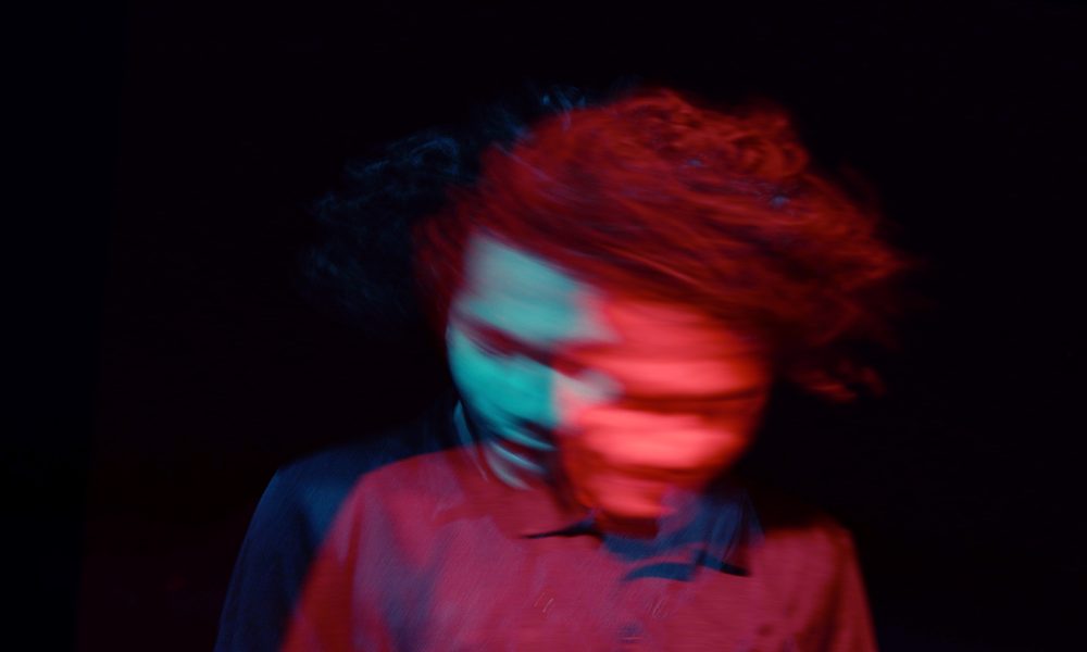 Man swinging his head