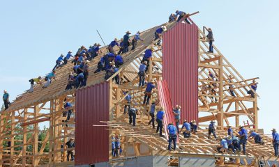People building structure during daytime