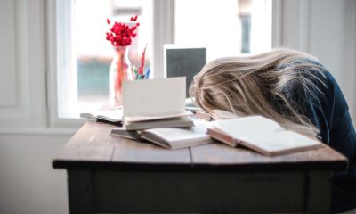 Woman Leaning on Table