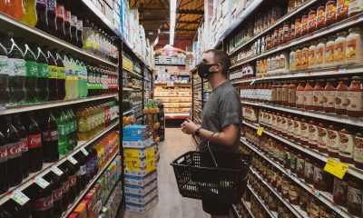 man looking at grocery