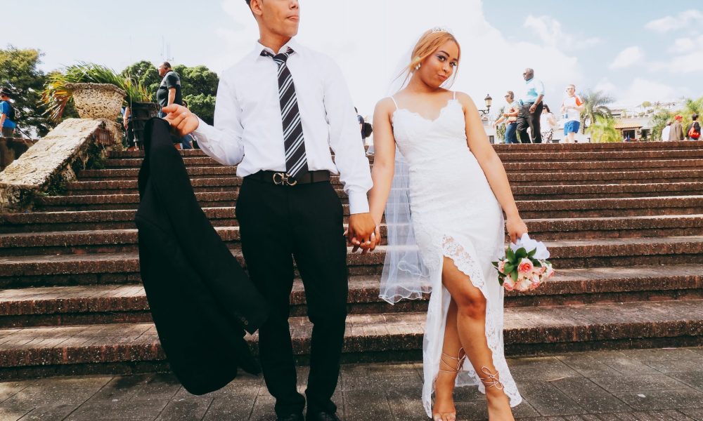 bride and groom walking down stairs