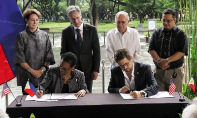 US Ambassador to the Philippines MaryKay Loss Carlson, US Secretary of State Antony Blinken, Philippine Ambassador to the US Jose Manuel Romualdez, and Energy Usec. Wimpy Fuentebella (standing, from left) witnessing a signing ceremony
