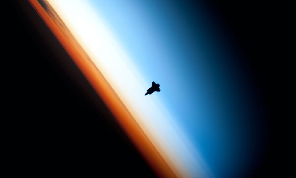 space shuttle above earth