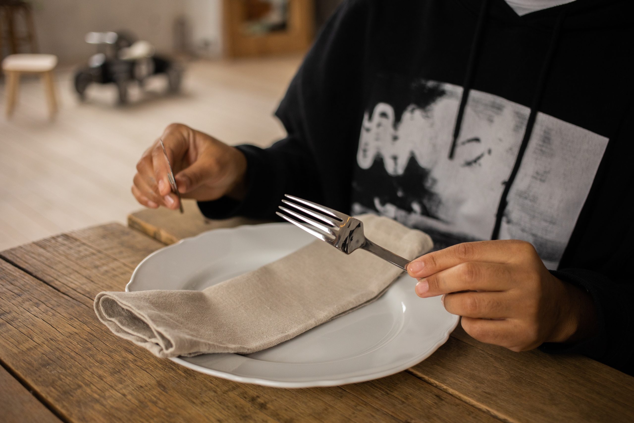 person at table with plate