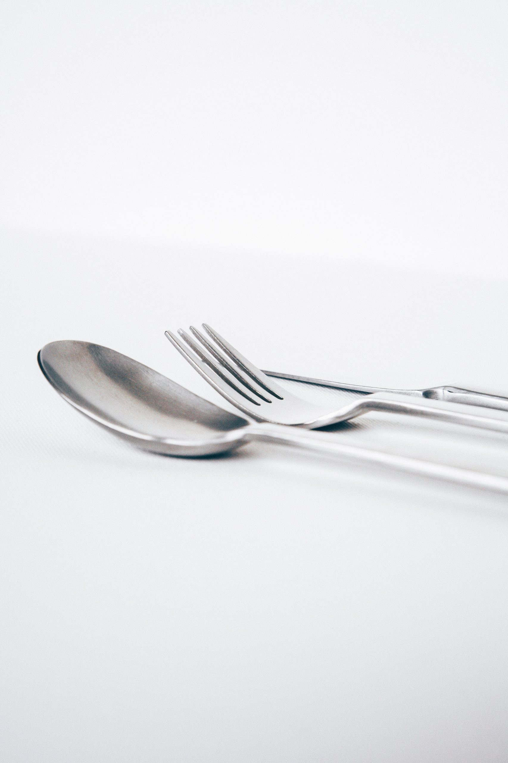 silver modern styled spoon, fork and knife