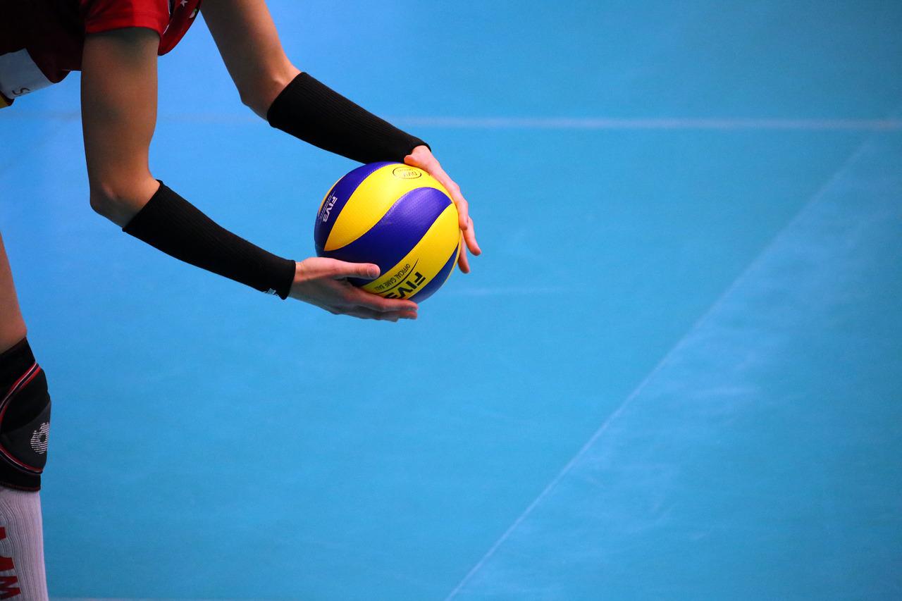 player holding volleyball