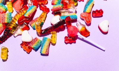 Close-Up Shot of Sweet Candies on Lilac Background