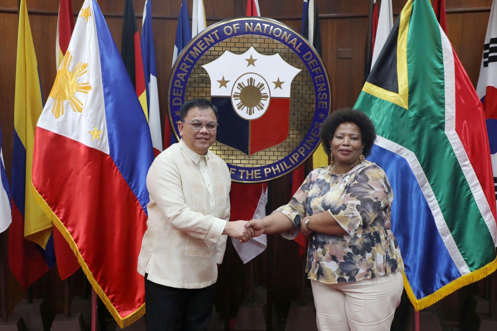 Department of National Defense (DND) officer-in-charge (OIC) Undersecretary Jose C. Faustino Jr. and South African Ambassador to Manila Bartinah Ntombizodwa Radebe-Netshitenzhe