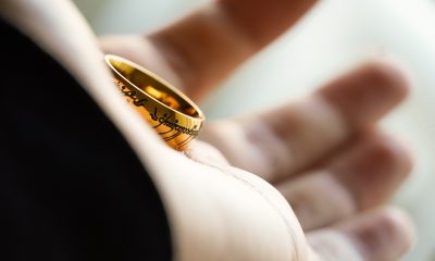 Gold ring on palm