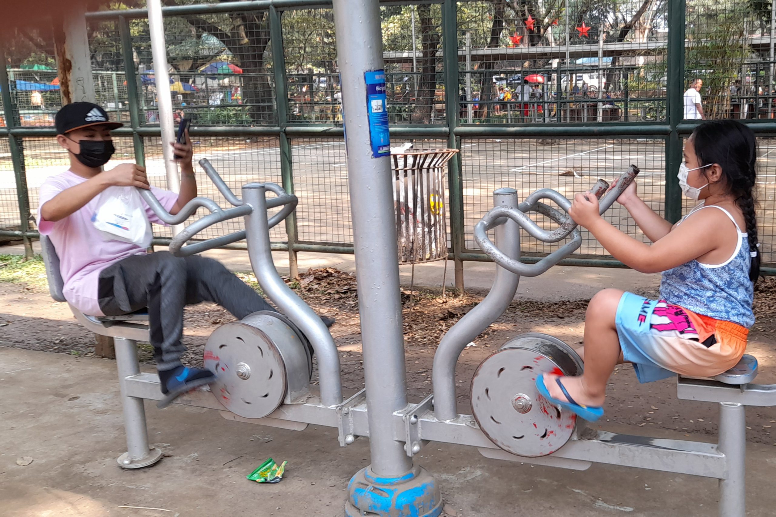 Two persons playing at the playground