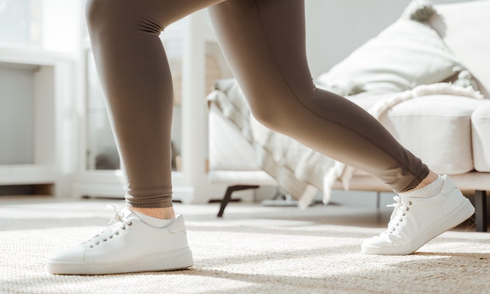 Woman in White Sneakers Doing Squats