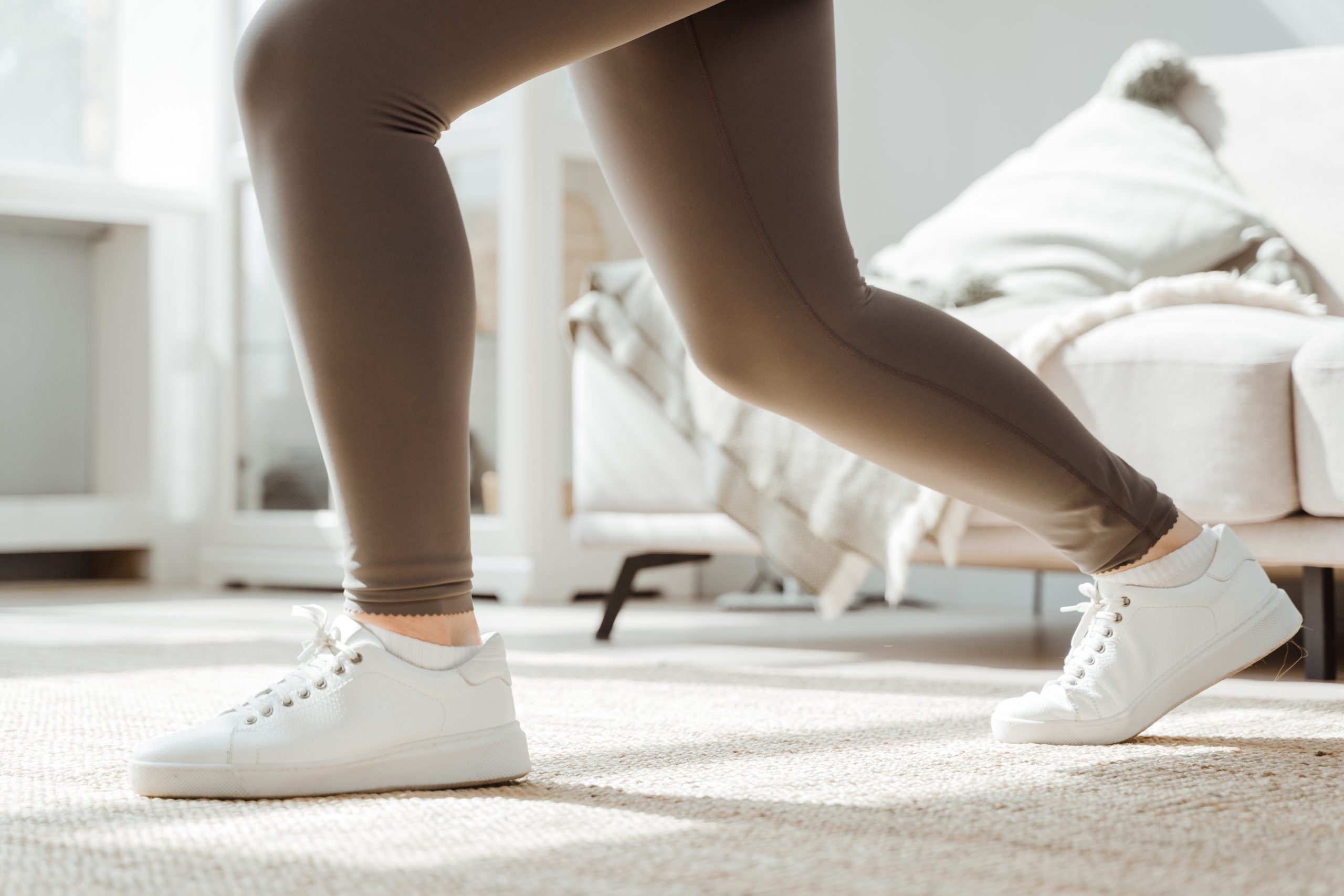 Woman in White Sneakers Doing Squats